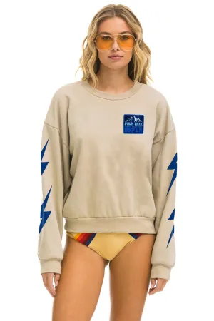 PALM TREE FESTIVAL ASPEN 2025 CREW SWEATSHIRT RELAXED - SAND
